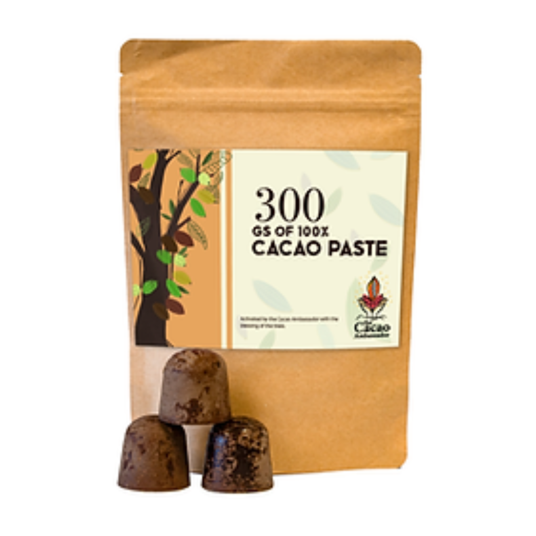 A 300g bag of 100% Pure Pacific Cacao Paste with a label showing the brand name, product name, and an illustration of a cacao tree. Three small balls of cacao paste are displayed in front of the bag.