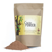 A package of PNG cacao powder with a small pile of cocoa powder in front of it, against a white background.